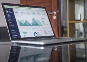 Statistical graph displayed on a laptop on a table