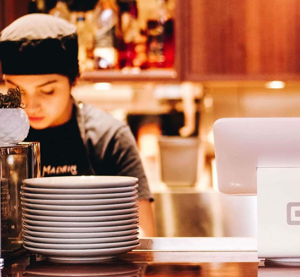 Photograph of woman at a restaurant counter