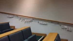 Wshing line of reference elements on a banister in a lecture hall