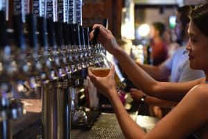 Image of woman serving beer