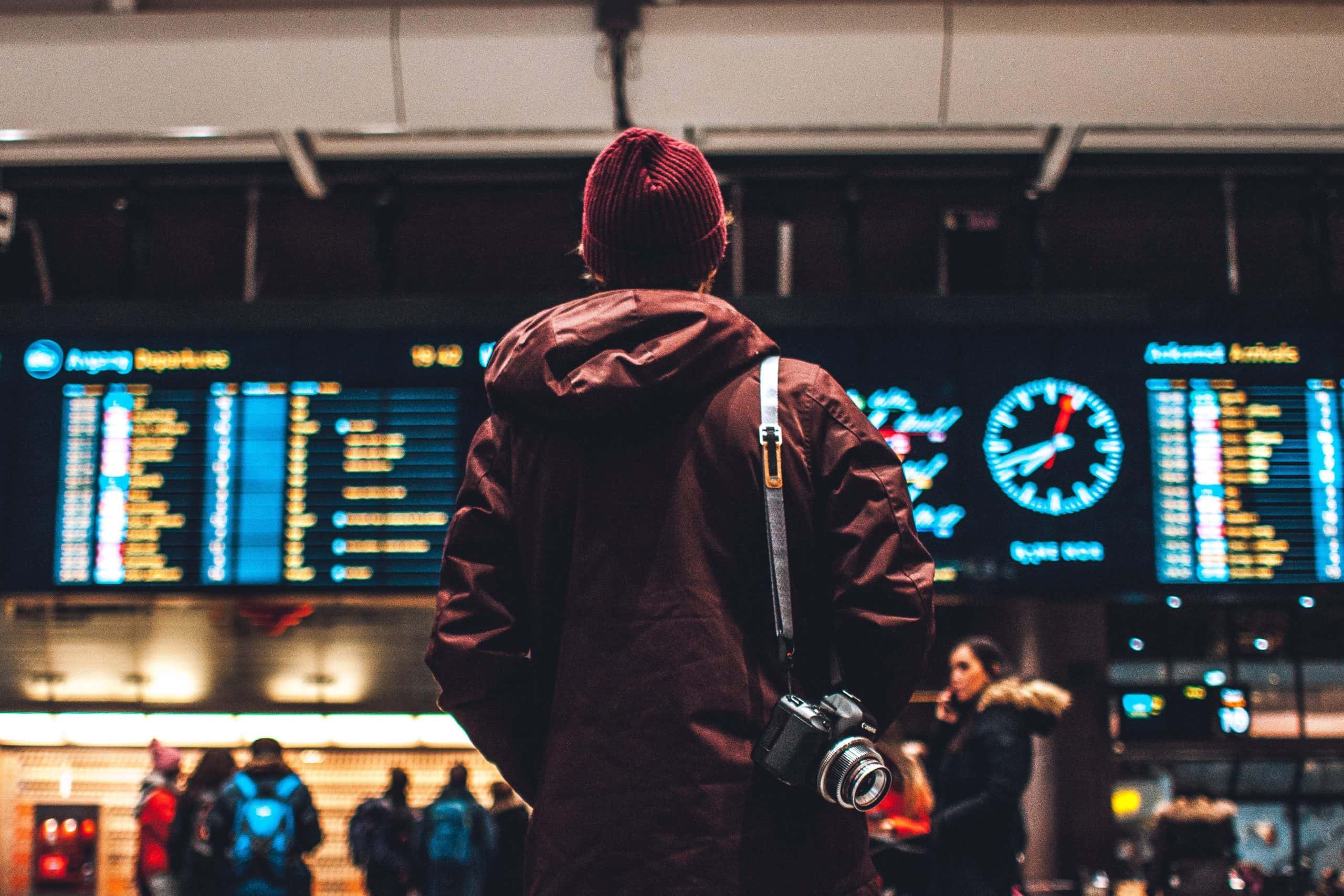 Person looking at airport departure board