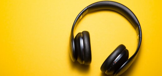 black headphones on yellow background, music, listening, podcast