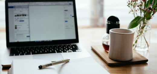 laptop, notepad and coffee mug