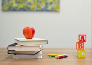 Apple on a small pile of books